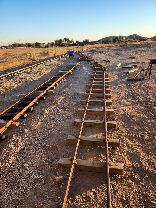 Train tracks winding through the desert
